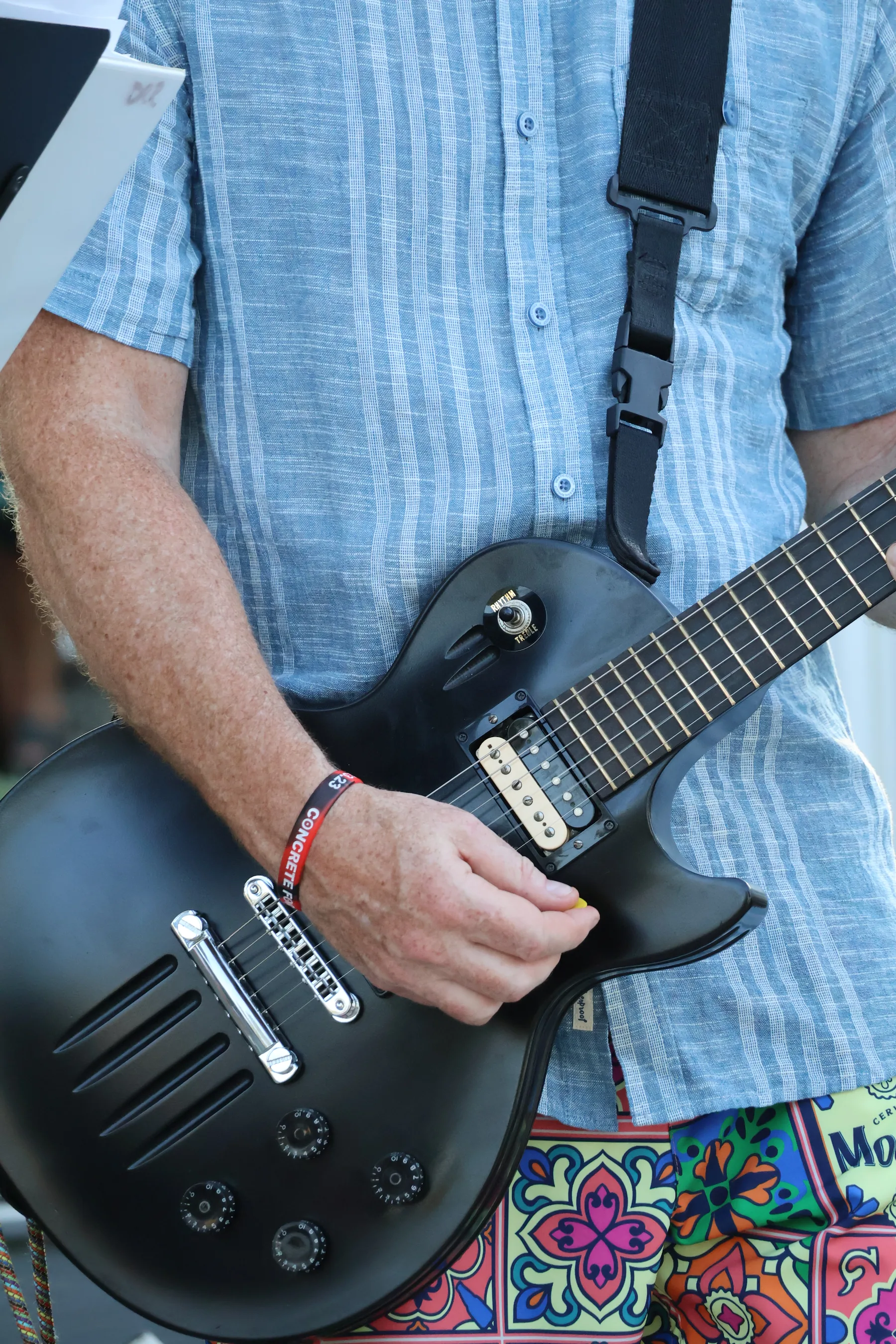 Close-up of a Dock Rock Rewind guitarist performing